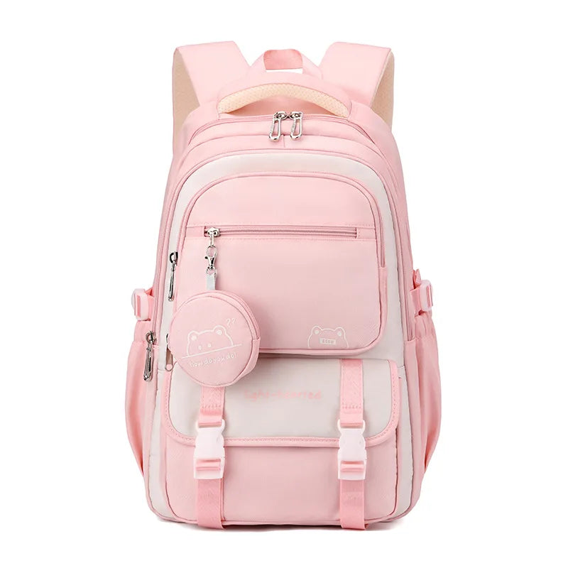 Sac à dos scolaire pink patchwork avec motifs dessin animé, idéal pour enfants, alliant style et fonctionnalité.