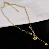 Collier long en acier avec pendentif cœur