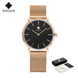 Montre femme WWOOR or rose avec cadran noir, bracelet maille milanaise, packaging inclus