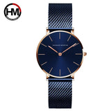 Montre femme Hannah Martin bleu marine avec boîtier et bracelet maille milanaise or rose