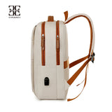 Vue latérale du sac à dos blanc cassé montrant les fermetures éclair et le port USB