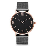 Montre femme élégante rose gold avec cadran noir et bracelet maille milanaise