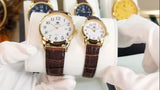 Montres OLEVS classiques pour femme avec cadran blanc et bracelet en cuir marron en gros plan