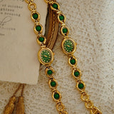 Deux montres ovales dorées Emakujitia avec bracelets ornés de pierres de jade vertes
