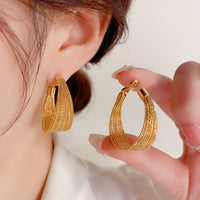 Boucles d'oreilles créoles en métal doré