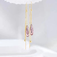 Synthetic crystal dangling earrings