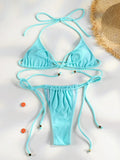 Ensemble bikini triangle jaune citron éclatant, bas string ajustable, sur tissu blanc
