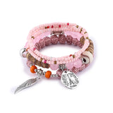 Ensemble de bracelets bohèmes roses avec perles en bois et breloques tour Eiffel et aile d'ange argentées