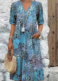 Robe bohème bleue à motif floral abstrait, col V et manches courtes, avec poches