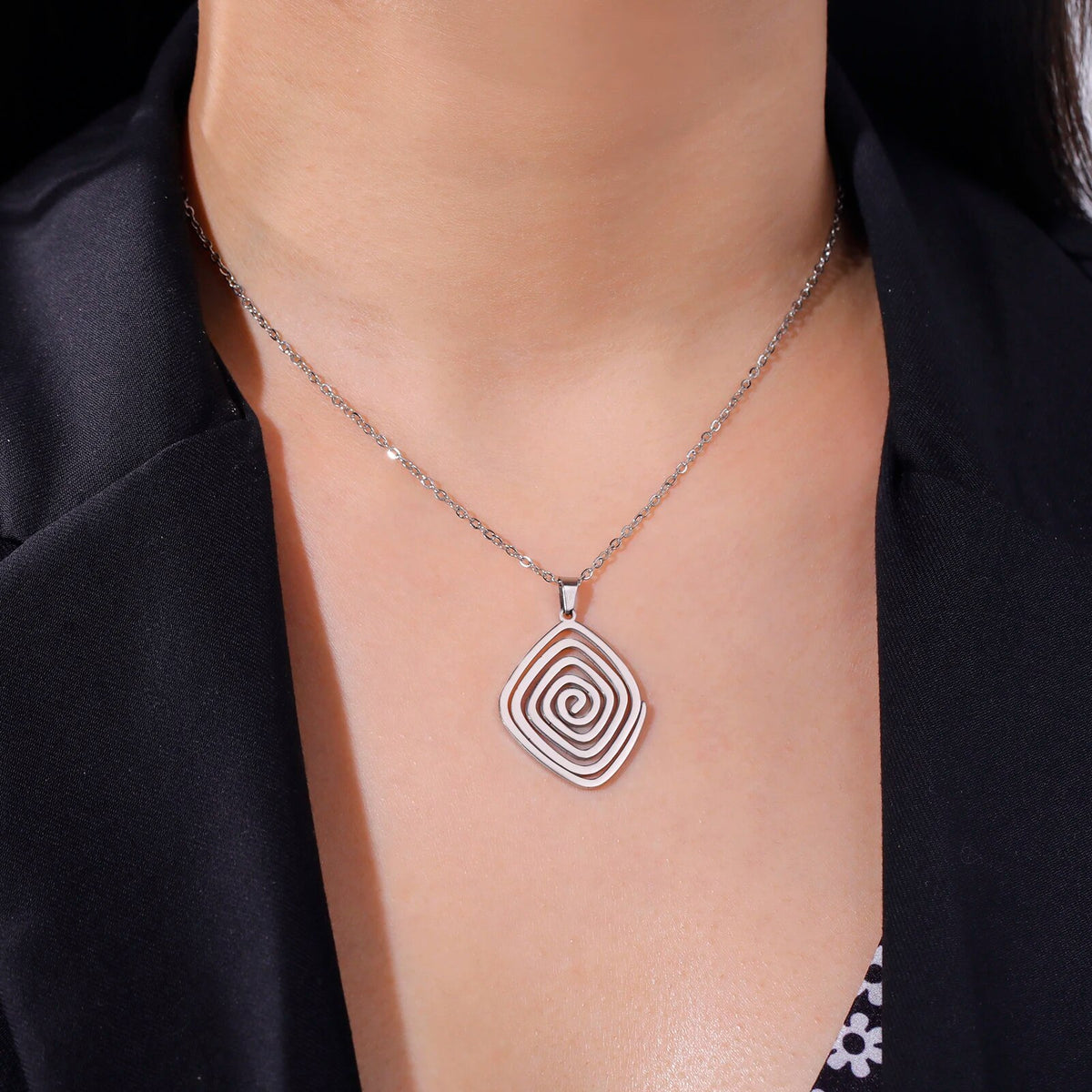 Necklace with spiral pendant