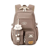 Sac à dos femme en nylon grande capacité, style collège japonais avec pendentifs mignons.