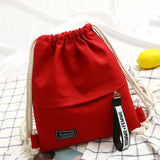 Sac à dos bohème en toile à cordon rouge, couleur vibrante et audacieuse