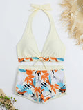 Ensemble bikini halter crème et short imprimé feuilles oranges et bleues