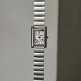 Montre femme cadran doré chiffres romains, bracelet marron clair