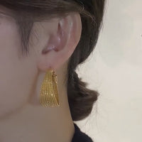 Boucles d'oreilles créoles en métal doré