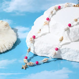 Collier fantaisie perles irrégulières vertes, roses et blanches avec étoiles de mer dorées et fausses perles en détail