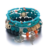 Ensemble de bracelets bohèmes bleus et turquoise avec perles en bois, breloques tour Eiffel et aile d'ange argentées