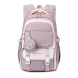 Sac à dos scolaire patchwork en nylon rose avec motifs cartoon, philosophie de style léger et pratique.