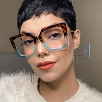 Oversized reading glasses with square frames for women.