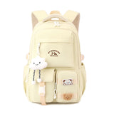 Sac à dos femme en nylon jaune avec pendentif nuage et ours, style collège japonais, grande capacité, pratique et tendance.