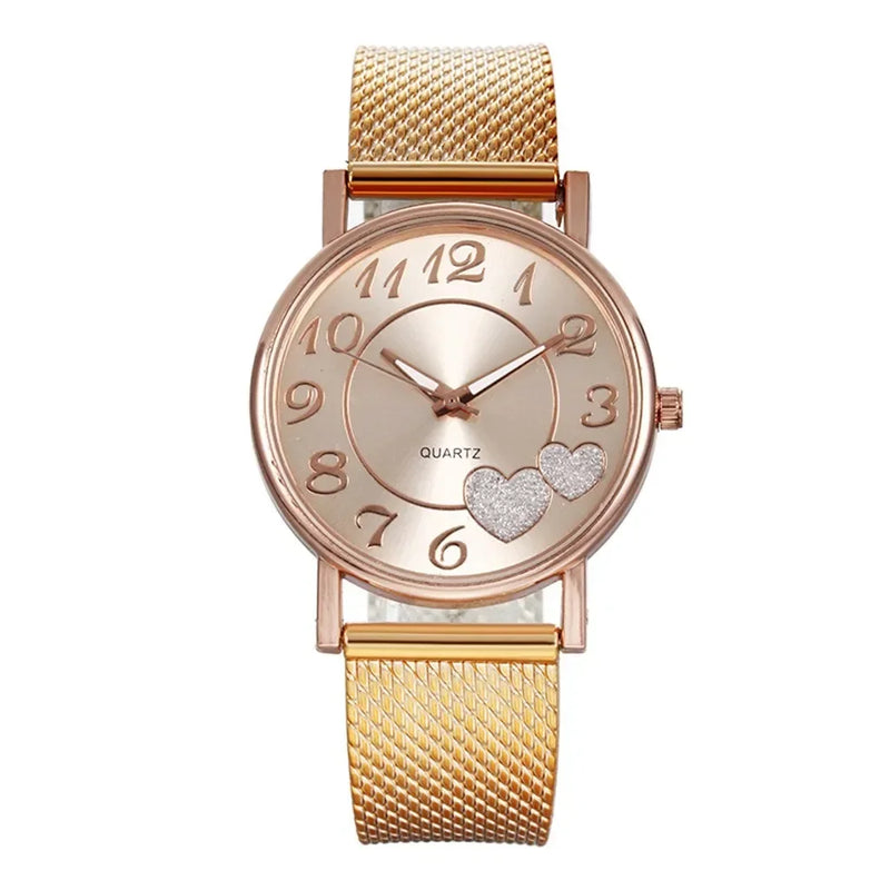 Montre femme élégante dorée rose avec cœurs scintillants et bracelet maille milanaise