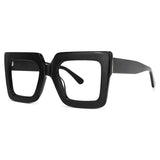Lunettes à montures carrées surdimensionnées transparentes pour femmes.