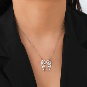 Collier avec pendentif ailes d'ange en acier inoxydable