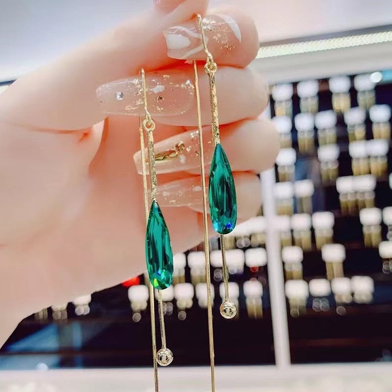 Synthetic crystal dangling earrings
