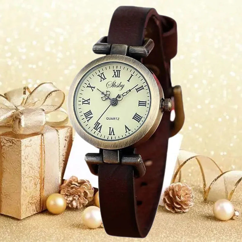 Montre vintage femme Emakujitia avec bracelet en cuir marron et cadran chiffres romains sur fond doré festif