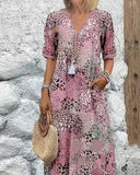 Robe bohème rose pastel avec motif floral abstrait, coupe fluide et col V