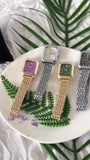 Montres carrées à bracelet acier inoxydable doré et argenté sur fond végétal