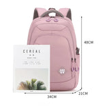 Sac à dos femme multifonction en nylon rose avec dimensions, idéal pour l'école et ordinateur.