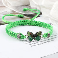 Pulsera mariposa verde en cuerda trenzada