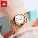 Montre femme maille milanaise rose doré portée au poignet