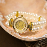 Montre bracelet perles synthétiques, cadran doré avec chiffres et aiguilles dorées