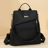 Vue arrière du sac à dos antivol femme en nylon noir, mettant en avant le compartiment sécurisé