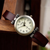 Montre vintage femme Emakujitia avec bracelet en cuir marron foncé et cadran chiffres romains