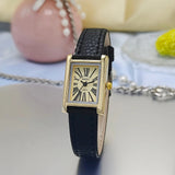 Montre femme cadran doré chiffres romains, bracelet bordeaux