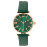 Montre femme bracelet cuir vert, cadran vert chiffres romains dorés et strass, sur fond blanc