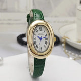 Montre ovale vintage avec bracelet en cuir vert, cadran doré et chiffres romains