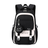 Sac à dos scolaire noir et blanc avec motif cartoon et inscription "light-hearted".