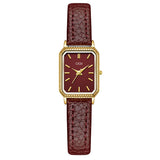 Montre femme vintage carrée GEDI, bracelet cuir rouge bordeaux, boîtier doré, portée au poignet