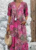 Robe bohème rose fuchsia à imprimé floral, manches courtes et col en V