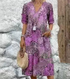 Robe bohème violette à imprimé fleuri, décolleté en V, idéale pour l'été