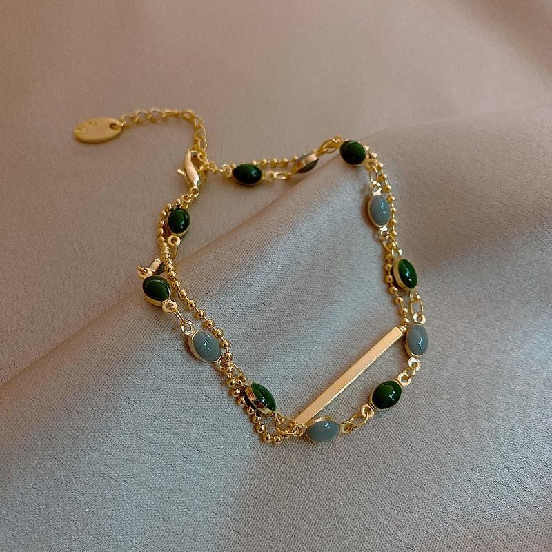 Bracelet double chaînes serti de perles vertes - EMAKUJITIA