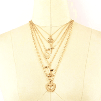 Collier bohème multicouche avec pendentif en forme de feuille - EMAKUJITIA