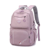 Sac à dos femme multifonction en nylon rose avec poches et fermeture éclair, idéal pour le voyage et l'université.