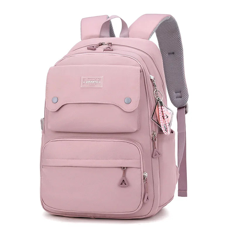 Sac à dos rose en nylon grande capacité avec bretelles réglables et poches pratiques pour filles.