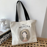 Sac fourre-tout en toile beige avec anses assorties, imprimé 'Today is Milk Tea Happy Day' et illustration
