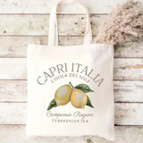 Sac cabas en toile blanc motif Capri Italia et citrons, sur fond de bois clair